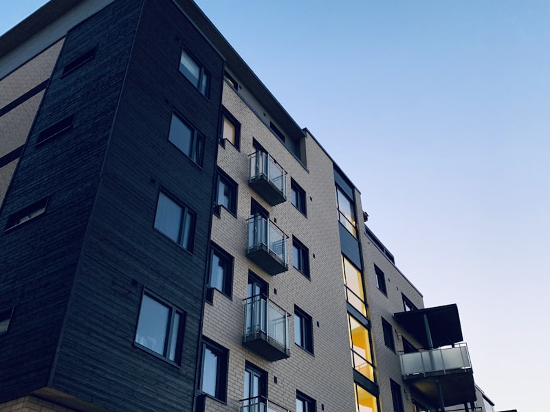 Front Range Mixed-Use — A 4-story mixed-use building with ground-floor retail, three floors of apartments, and a shared rooftop amenity deck in Denver's Cole neighborhood